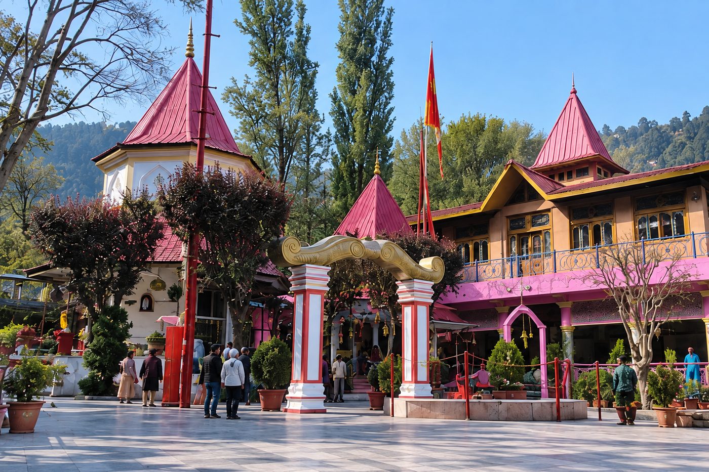 Naina Devi temple complex in Mallital, Nainital, with pink-roofed shrines and visitors in the courtyard