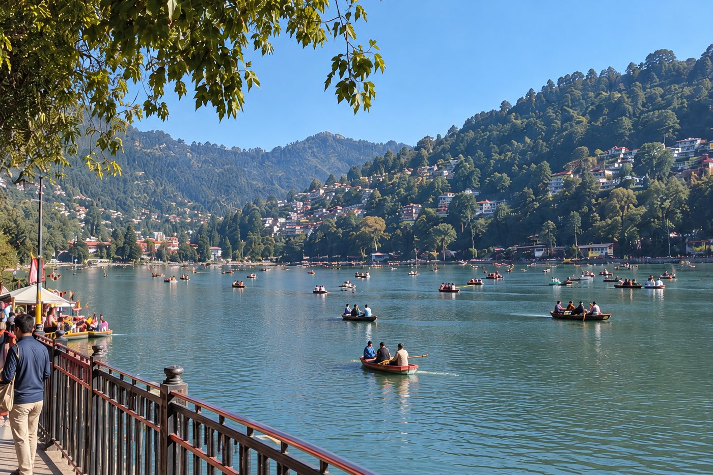 Naini Lake surrounded by wooded hills and buildings, viewed from the Mallital promenade near the Naina Devi temple